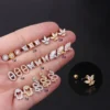 H31ce6ab5cbfa43fdb70e08e5839c9e6e8.webp Trendy Plated Stud Earrings With Solid Brass and Platinum Featuring Snake and Flower Designs With Zircon and Stone